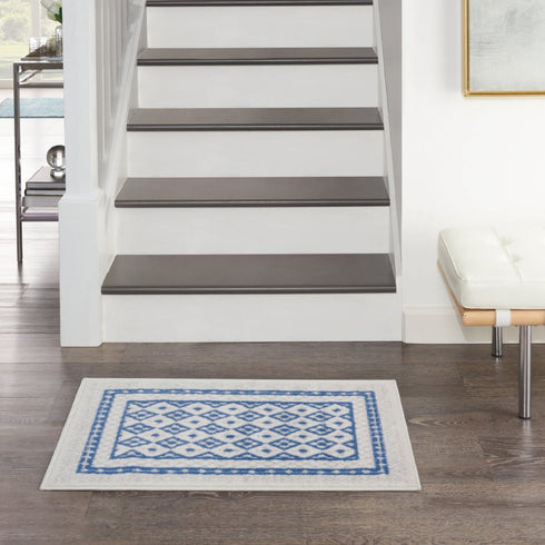 Ivory and Blue Geometric Area Rug